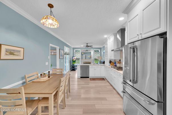 Dining room, Interior, Kitchen, Pendant Lights, Recessed Lighting, Stainless Steel Appliances, Wood Texture Flooring