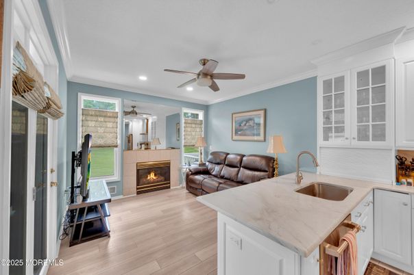 Fireplace, Interior, Kitchen, Recessed Lighting, Wood Texture Flooring