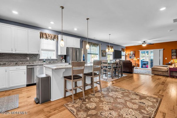 Dining room, Interior, Kitchen, Living room, Pendant Lights, Recessed Lighting, Stainless Steel Appliances, Wood Texture Flooring