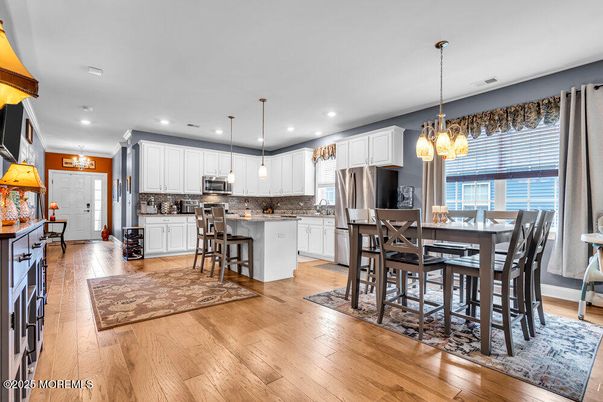 Chandelier, Dining room, Interior, Kitchen, Pendant Lights, Recessed Lighting, Stainless Steel Appliances, Wood Texture Flooring