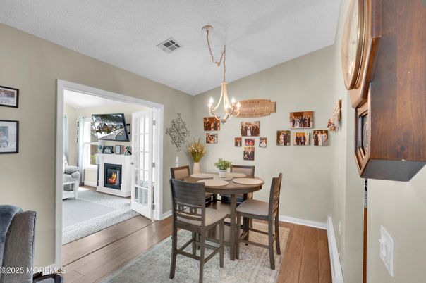 Chandelier, Dining room, Fireplace, Interior, Wood Texture Flooring