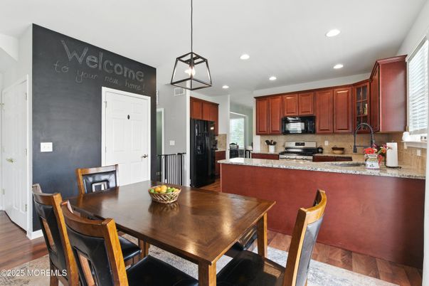 Dining room, Interior, Kitchen, Pendant Lights, Recessed Lighting, Stainless Steel Appliances, Wood Texture Flooring