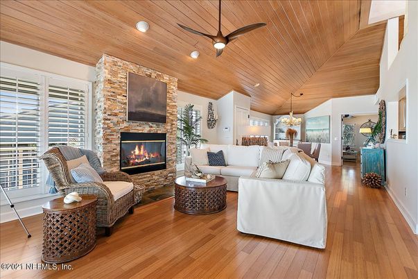 Chandelier, Dining room, Fireplace, Interior, Living room, Pendant Lights, Recessed Lighting, Stone Walls, Wooden Ceilings, Wood Texture Flooring