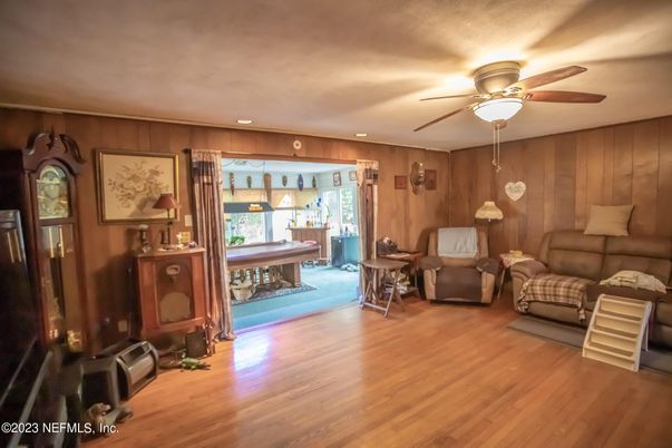 Billiard Table, Dining room, Game Room, Interior, Living room, Piano, Recessed Lighting, Wood Texture Flooring, Wooden Walls