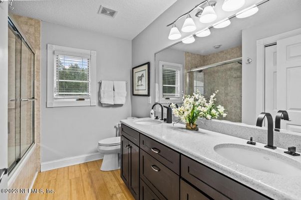 Bathroom, Dual Sink Vanities, Glass Shower, Interior, Wood Texture Flooring