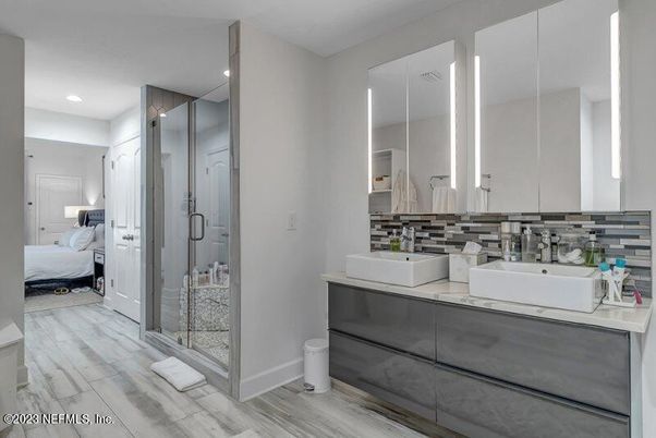 Bathroom, Bedroom, Dual Sink Vanities, Glass Shower, Interior, Recessed Lighting, Wood Texture Flooring