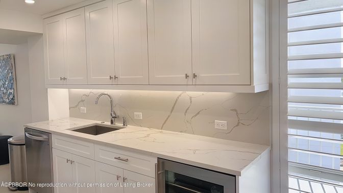 Interior, Kitchen, Marble Walls, Recessed Lighting, Stainless Steel Appliances