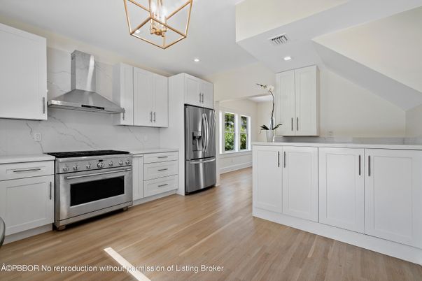 Interior, Kitchen, Marble Walls, Recessed Lighting, Stainless Steel Appliances, Wood Texture Flooring