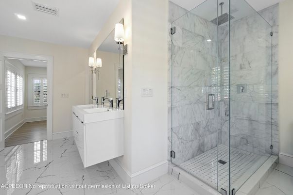 Bathroom, Dual Sink Vanities, Glass Shower, Interior, Marble, Marble Walls, Recessed Lighting
