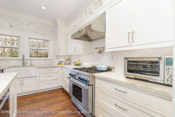 Interior, Kitchen, Marble Walls, Recessed Lighting, Stainless Steel Appliances, Wood Texture Flooring
