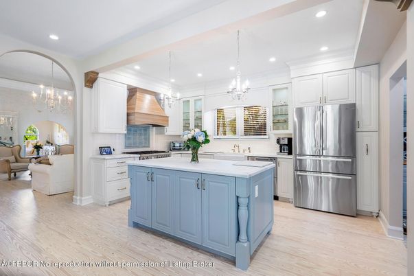 Chandelier, Interior, Kitchen, Living room, Pendant Lights, Recessed Lighting, Stainless Steel Appliances, Wood Texture Flooring