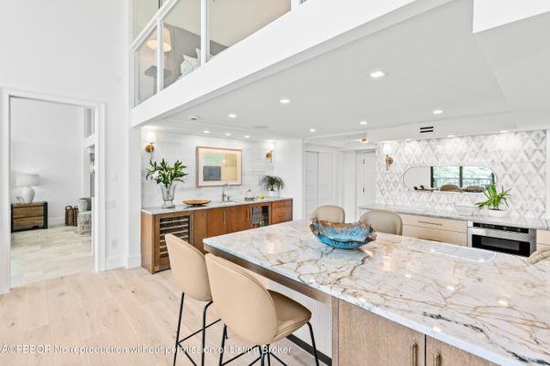 Interior, Kitchen, Marble Walls, Recessed Lighting, Stainless Steel Appliances, Wood Texture Flooring