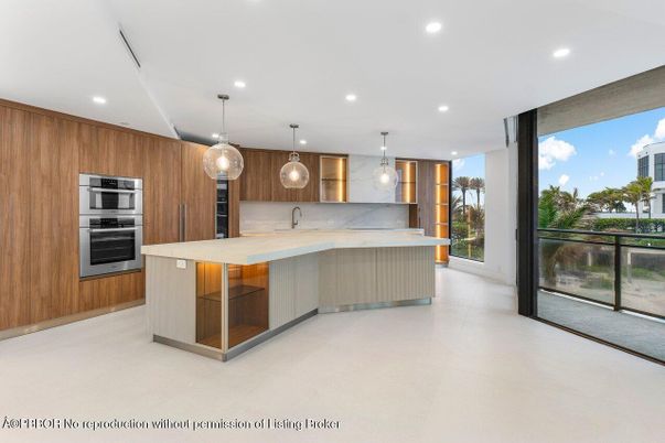 Interior, Kitchen, Marble Walls, Pendant Lights, Recessed Lighting, Stainless Steel Appliances