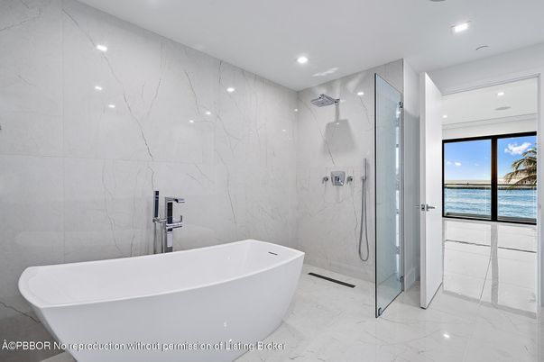 Bathroom, Free Standing Baths, Glass Shower, Interior, Marble, Marble Walls, Recessed Lighting, Water
