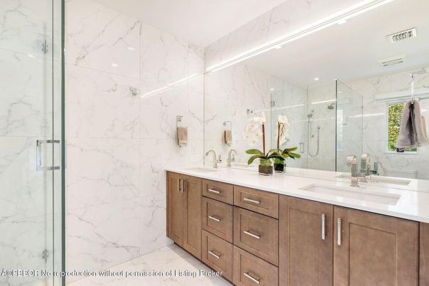 Bathroom, Dual Sink Vanities, Glass Shower, Interior, Marble, Marble Walls, Recessed Lighting