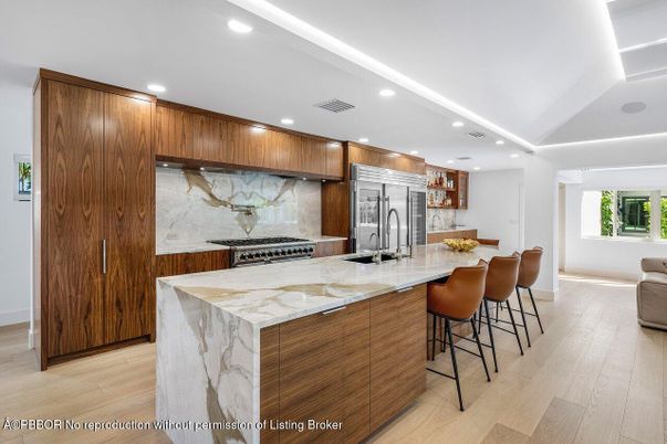 Interior, Kitchen, Marble Walls, Recessed Lighting, Stainless Steel Appliances, Wood Texture Flooring