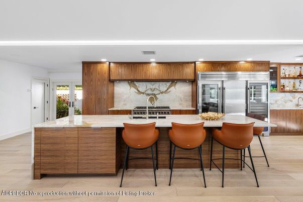 Interior, Kitchen, Marble Walls, Recessed Lighting, Stainless Steel Appliances, Wood Texture Flooring