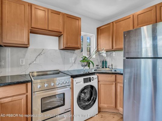 Interior, Kitchen, Marble Walls, Washer, Wood Texture Flooring