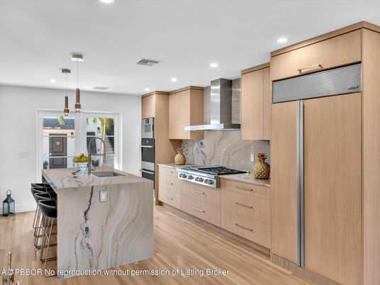 Interior, Kitchen, Marble Walls, Pendant Lights, Recessed Lighting, Stainless Steel Appliances, Wood Texture Flooring