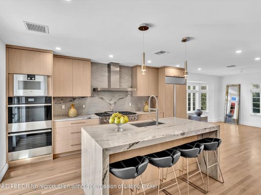Interior, Kitchen, Marble Walls, Pendant Lights, Recessed Lighting, Stainless Steel Appliances, Wood Texture Flooring
