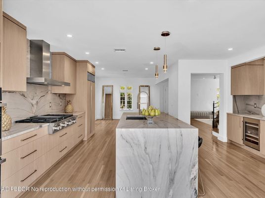 Interior, Kitchen, Marble Walls, Pendant Lights, Recessed Lighting, Stainless Steel Appliances, Wood Texture Flooring