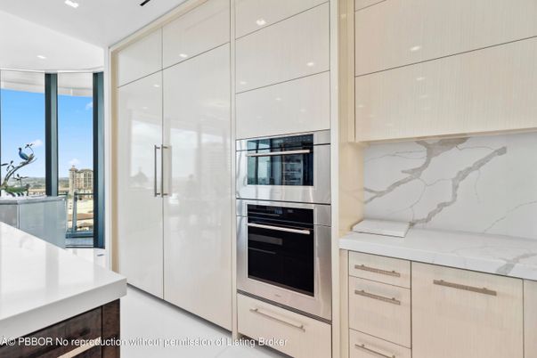 Interior, Kitchen, Marble Walls, Recessed Lighting, Stainless Steel Appliances