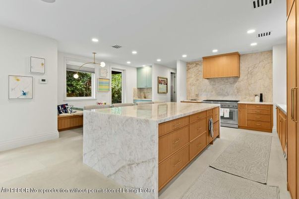 Interior, Kitchen, Marble Walls, Pendant Lights, Recessed Lighting, Stainless Steel Appliances