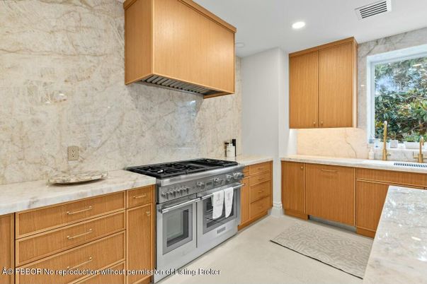 Interior, Kitchen, Marble Walls, Recessed Lighting, Stainless Steel Appliances