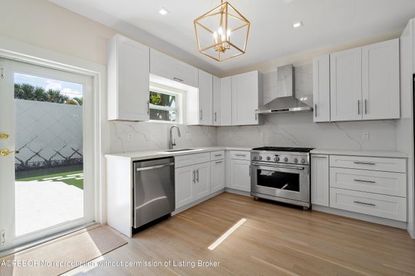 Interior, Kitchen, Marble Walls, Recessed Lighting, Stainless Steel Appliances, Wood Texture Flooring