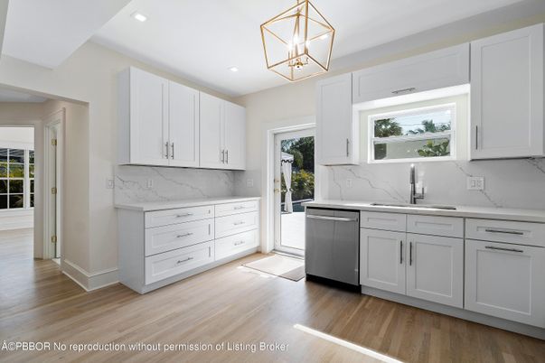 Interior, Kitchen, Marble Walls, Pendant Lights, Recessed Lighting, Stainless Steel Appliances, Wood Texture Flooring