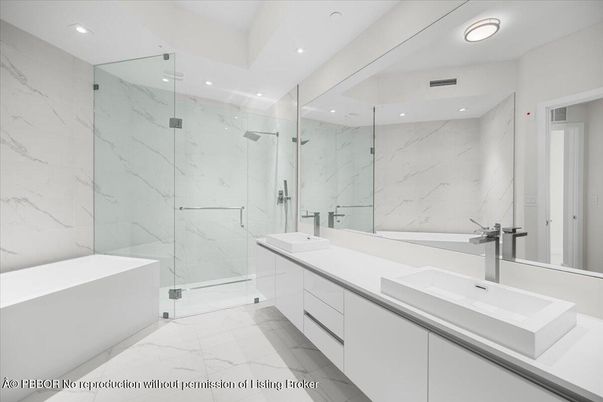 Bathroom, Dual Sink Vanities, Glass Shower, Interior, Marble, Marble Walls, Recessed Lighting