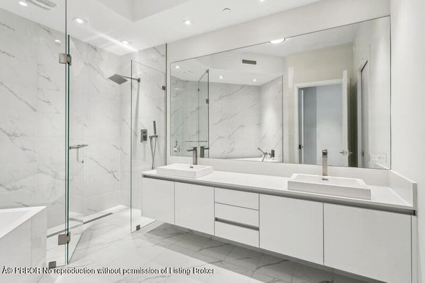 Bathroom, Dual Sink Vanities, Glass Shower, Interior, Marble, Marble Walls, Recessed Lighting