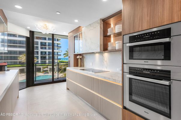 Interior, Kitchen, Marble Walls, Recessed Lighting, Stainless Steel Appliances