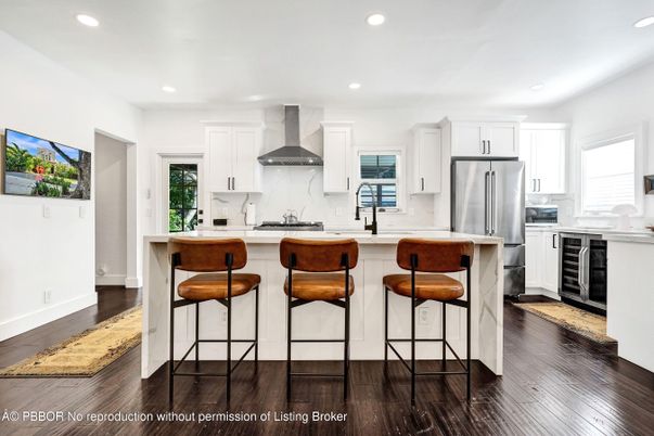 Interior, Kitchen, Marble Walls, Recessed Lighting, Stainless Steel Appliances, Wood Texture Flooring