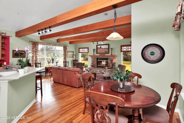 Dining room, Fireplace, Interior, Living room, Pendant Lights, Wooden Beams, Wood Texture Flooring