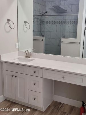 Bathroom, Dual Sink Vanities, Interior, Marble Walls, Wood Texture Flooring