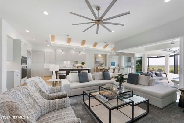 Chandelier, Dining room, Interior, Kitchen, Living room, Pendant Lights, Recessed Lighting, Stainless Steel Appliances, Wood Texture Flooring