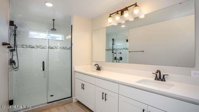 Bathroom, Dual Sink Vanities, Glass Shower, Interior, Recessed Lighting, Wood Texture Flooring