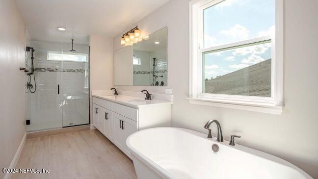 Bathroom, Dual Sink Vanities, Glass Shower, Interior, Recessed Lighting, Wood Texture Flooring