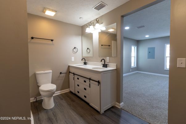 Bathroom, Dual Sink Vanities, Interior, Recessed Lighting, Wood Texture Flooring