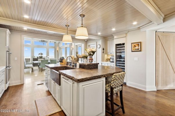 Dining room, Interior, Kitchen, Living room, Pendant Lights, Recessed Lighting, Stainless Steel Appliances, Wooden Ceilings, Wood Texture Flooring