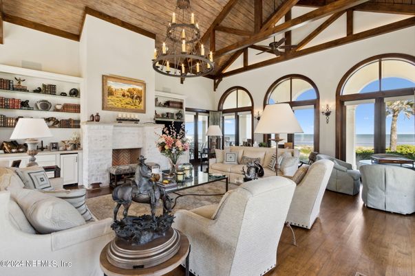 Chandelier, Fireplace, Interior, Living room, Water, Wooden Beams, Wooden Ceilings, Wood Texture Flooring