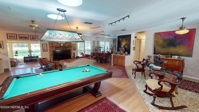 Billiard Table, Fireplace, Game Room, Interior, Living room, Pendant Lights, Wood Texture Flooring