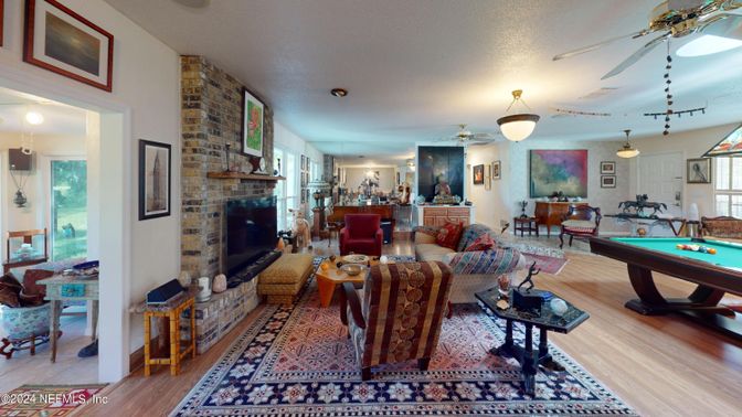 Billiard Table, Fireplace, Game Room, Interior, Living room, Pendant Lights, Stone Walls, Wood Texture Flooring