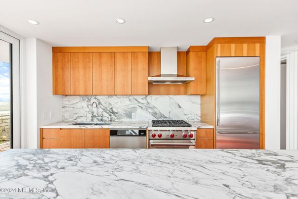 Interior, Kitchen, Marble Walls, Recessed Lighting, Stainless Steel Appliances