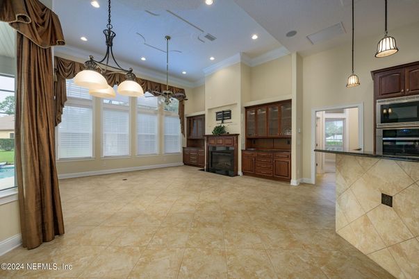 Empty room, Fireplace, Interior, Kitchen, Pendant Lights, Recessed Lighting, Stainless Steel Appliances