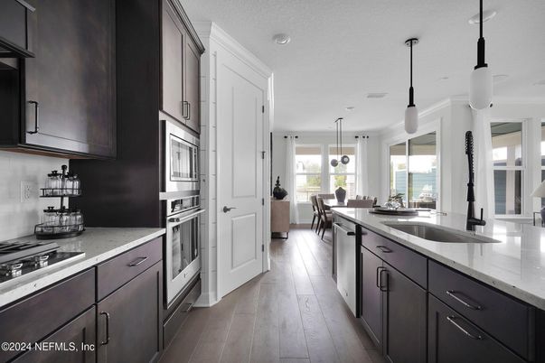 Dining room, Interior, Kitchen, Pendant Lights, Recessed Lighting, Stainless Steel Appliances, Wood Texture Flooring