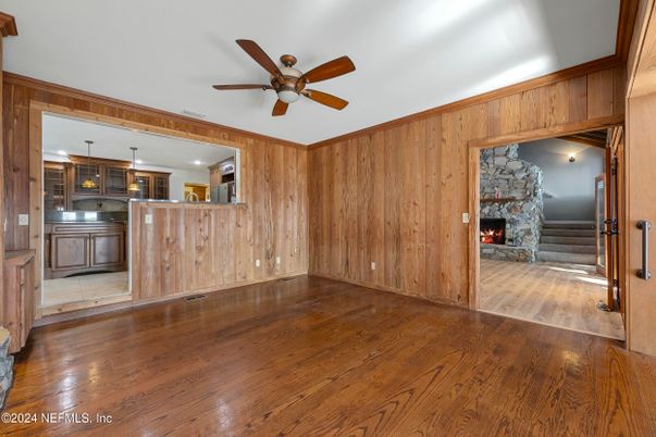 Empty room, Fireplace, Interior, Kitchen, Pendant Lights, Wood Texture Flooring, Wooden Walls