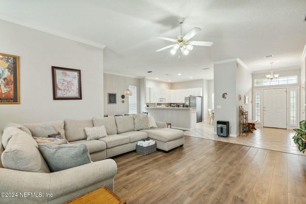 Chandelier, Interior, Kitchen, Living room, Pendant Lights, Recessed Lighting, Stainless Steel Appliances, Wood Texture Flooring