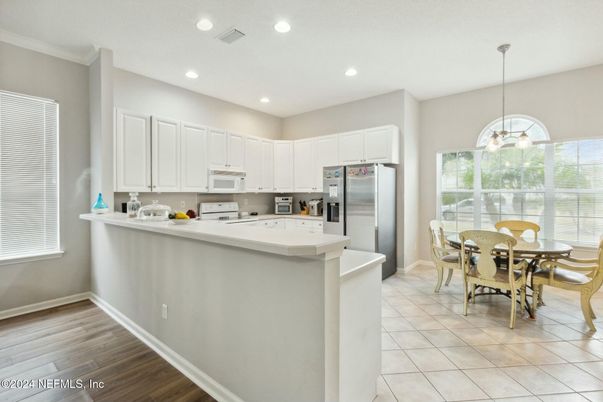 Dining room, Interior, Kitchen, Pendant Lights, Recessed Lighting, Stainless Steel Appliances, Wood Texture Flooring